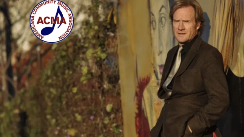 Rupert Wates leaning against a wall; ACMA logo in corner