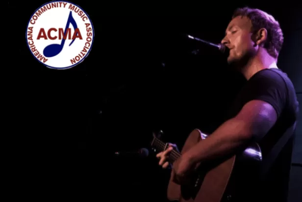 James Kirby playing guitar
